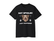 a black t - shirt with a picture of a dog's face on it