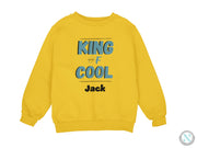 a yellow sweatshirt with the words king of cool printed on it