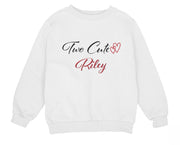 a young girl wearing a white sweatshirt with two cute hearts on it