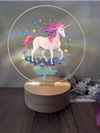 a glass ball with a picture of a unicorn on it