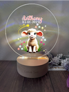 a personalized glass ornament with a sheep on it