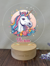 a personalized acrylic with a unicorn on it