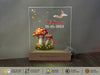 a glass plaque with a picture of a mushroom on it