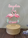 a personalized acrylic with two pink flamingos