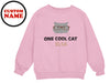 a pink sweatshirt with a cat wearing glasses