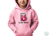 a young boy wearing a pink hoodie with the letter b is for bella