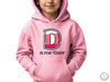 a young boy wearing a pink hoodie with the letter d on it