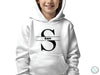 a young girl wearing a white hoodie with the letter c on it