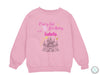 a pink sweatshirt with a castle on it